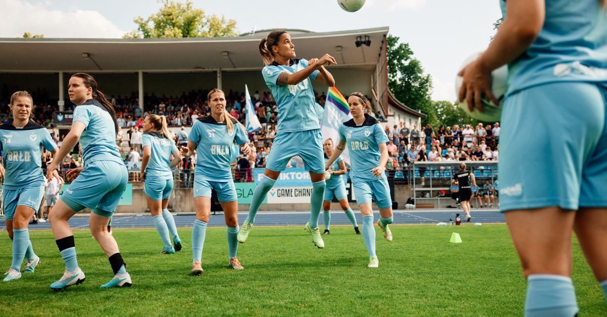 Women's soccer players warm up before a game and now use daily planners to help orient their menstrual cycle with the training.