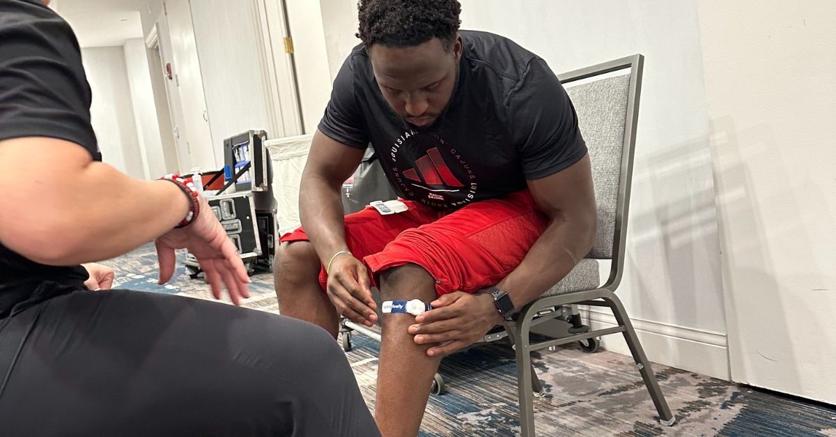 A university of louisiana football player wears a firefly recovery device.