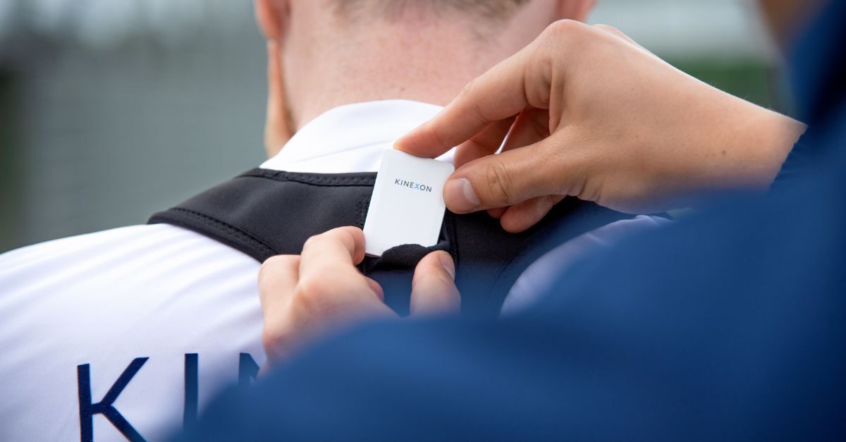 A sports vest that is worn under a player's game jersey, or over a practice jersey can hold a player tracking wearable device.