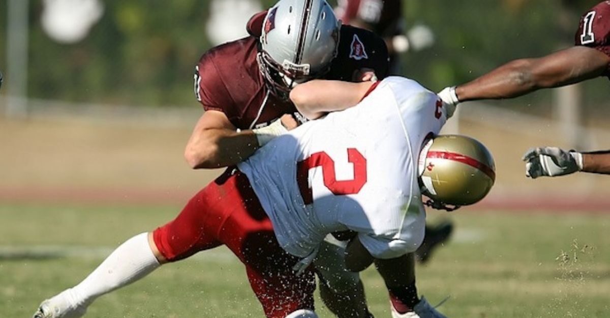A football player is injured while making a tackle during a game, but having a sound return-to-play protocol helps get players back on the field safely.