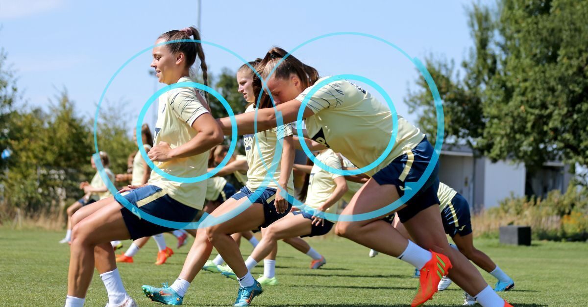Members of a women's football (soccer) team train for an upcoming match while wearing player tracking devices that collects sports data and helps them to peak during a match..
