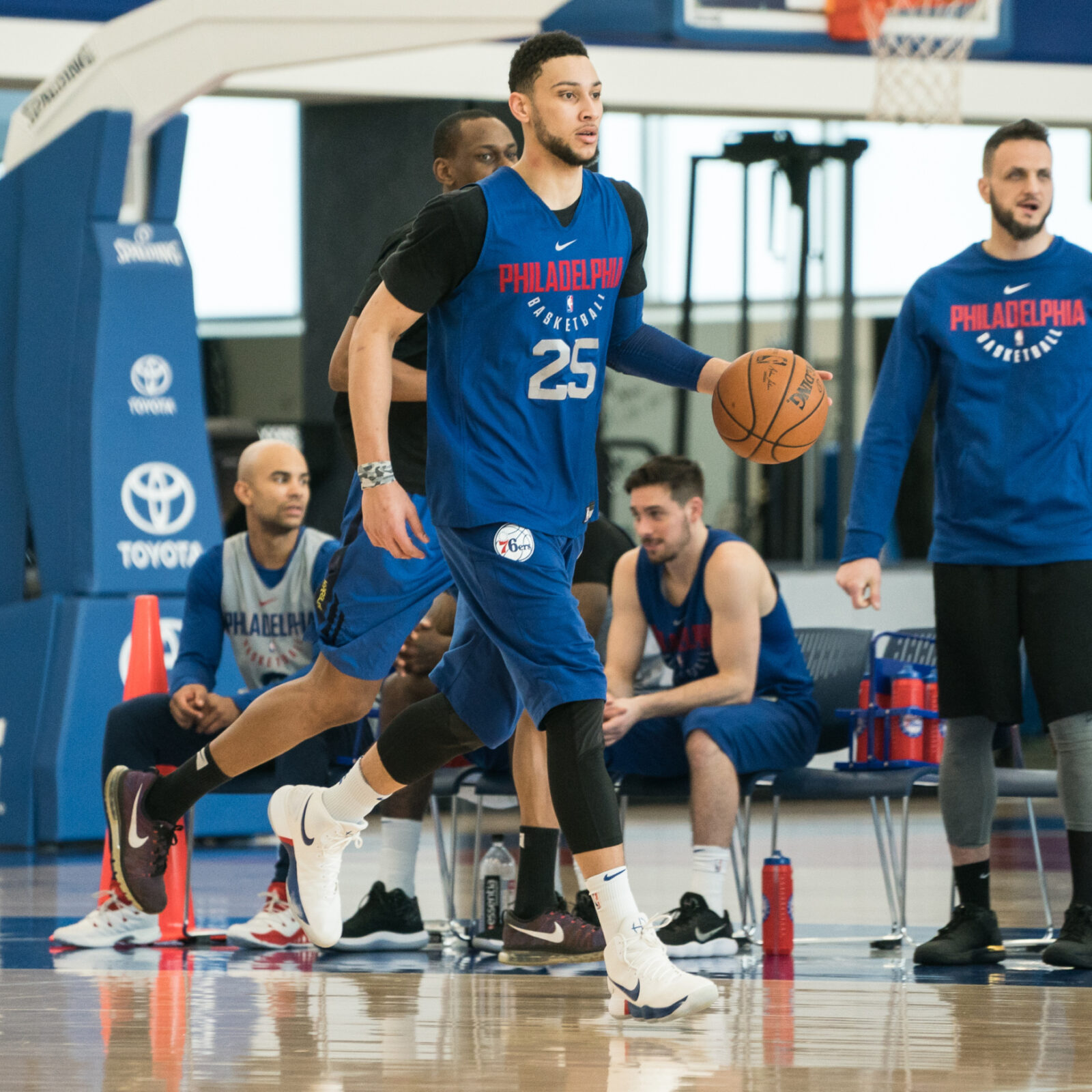 Basketball training scene blue player with ball