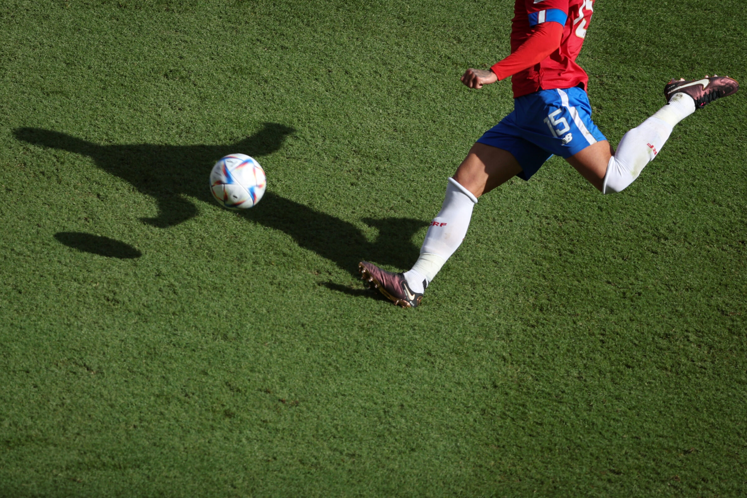 A player kicks a ball that is equipped with a sensor and provides data to coaches and sports analysts.