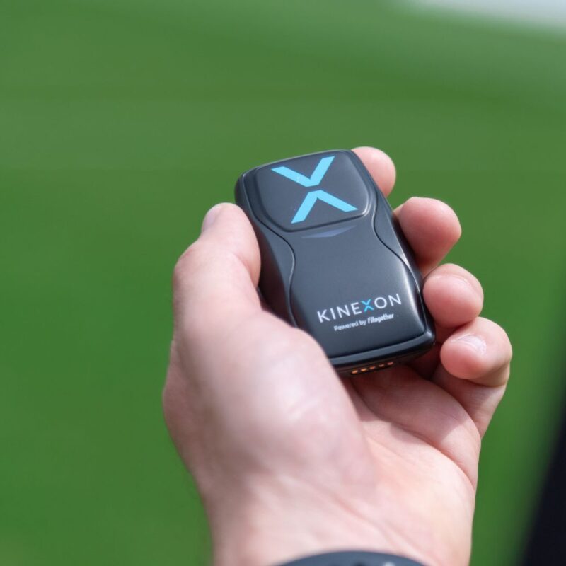An athlete trackers, which is also called a player tracker is prepared by a coach for a player to wear during a practice.